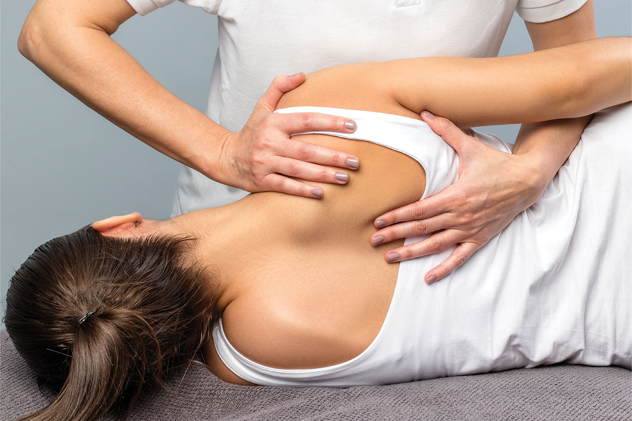 Chiropractic adjustement, Woman's back with doctor's hands